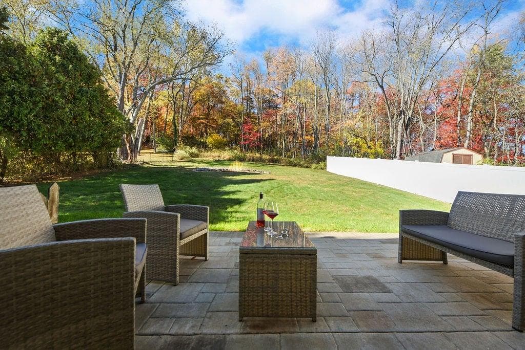 Enjoy serene mornings or cozy evenings on the patio overlooking a lush backyard. Perfect for sipping coffee, unwinding with a book, or sharing a glass of wine surrounded by nature’s beauty